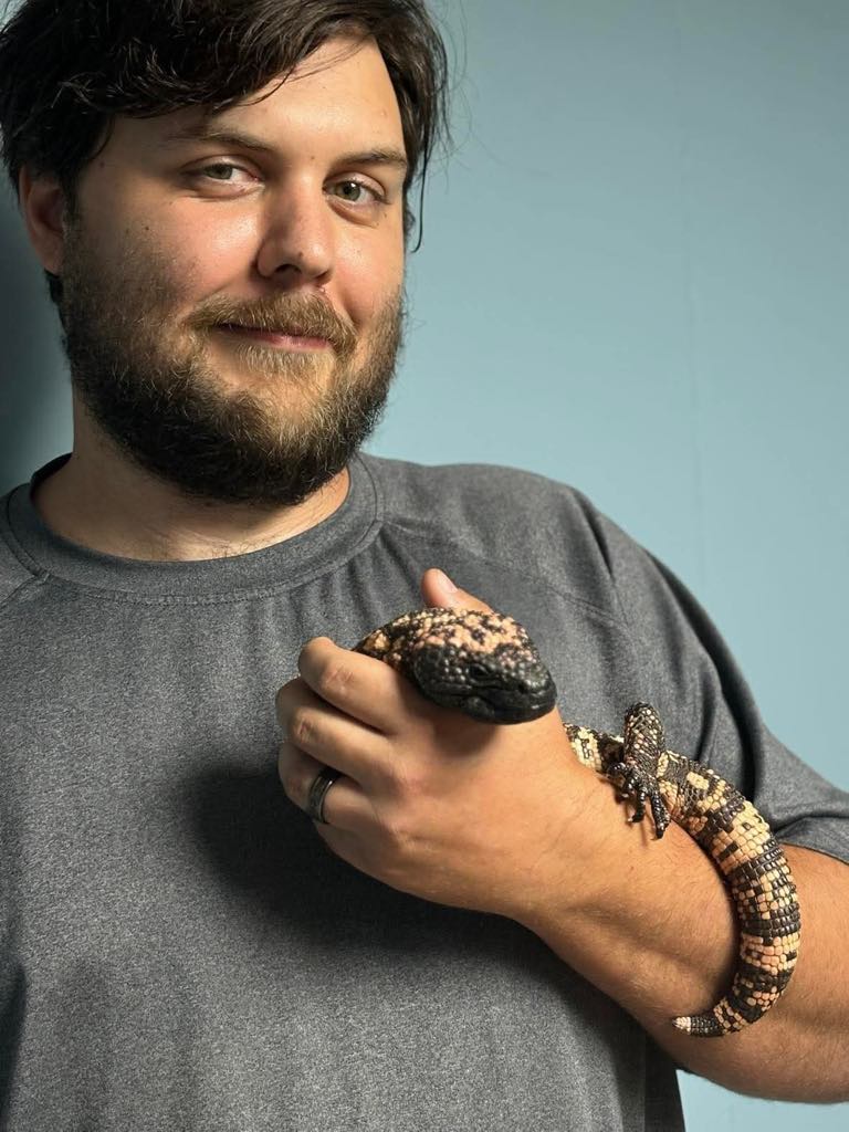 Jackson holding a tegu